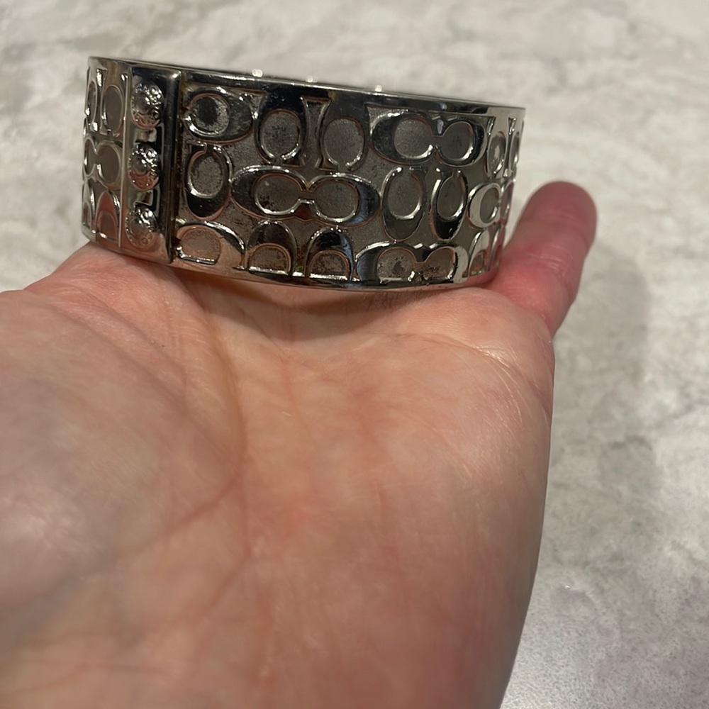 Silver Coach cuff bracelet. 2.5 in diameter